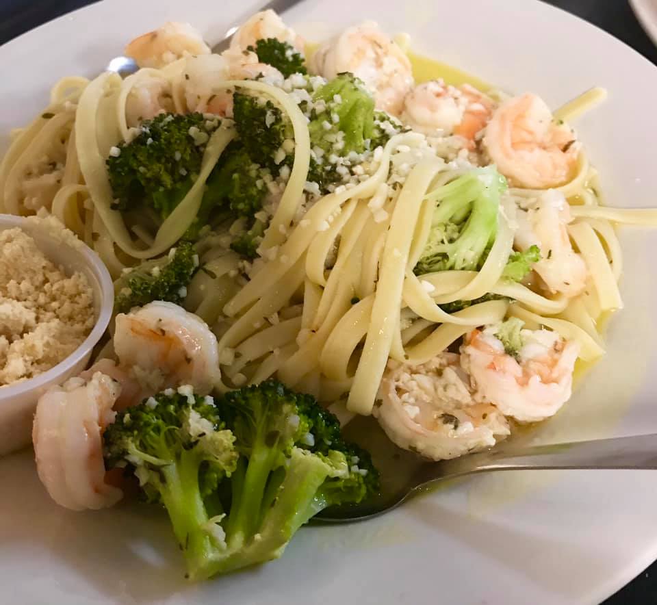 Shrimp scampi garnished with broccoli